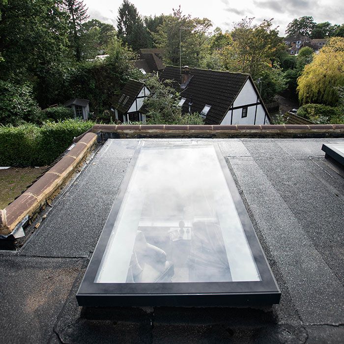Rectangular grey roof light on flat roof